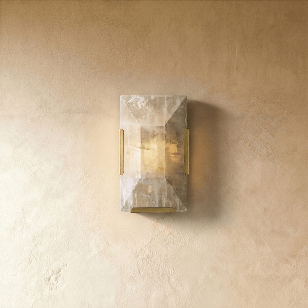 Residence Supply Sakhra Wall Lamp with textured ceramic finish and modern design mounted on a wall.