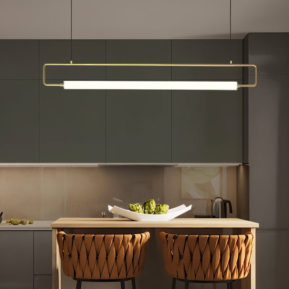 Modern Sanaa Pendant Light by Residence Supply with a sleek design and warm metal finish hanging from a ceiling.