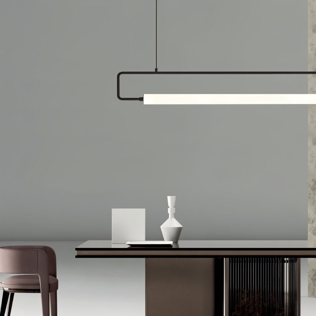 Modern Sanaa Pendant Light by Residence Supply with a sleek design and warm lighting, hanging from a ceiling fixture.