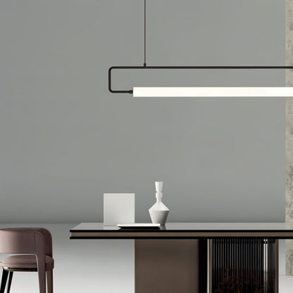 Modern Sanaa Pendant Light by Residence Supply with a sleek design and warm lighting, hanging from a ceiling fixture.