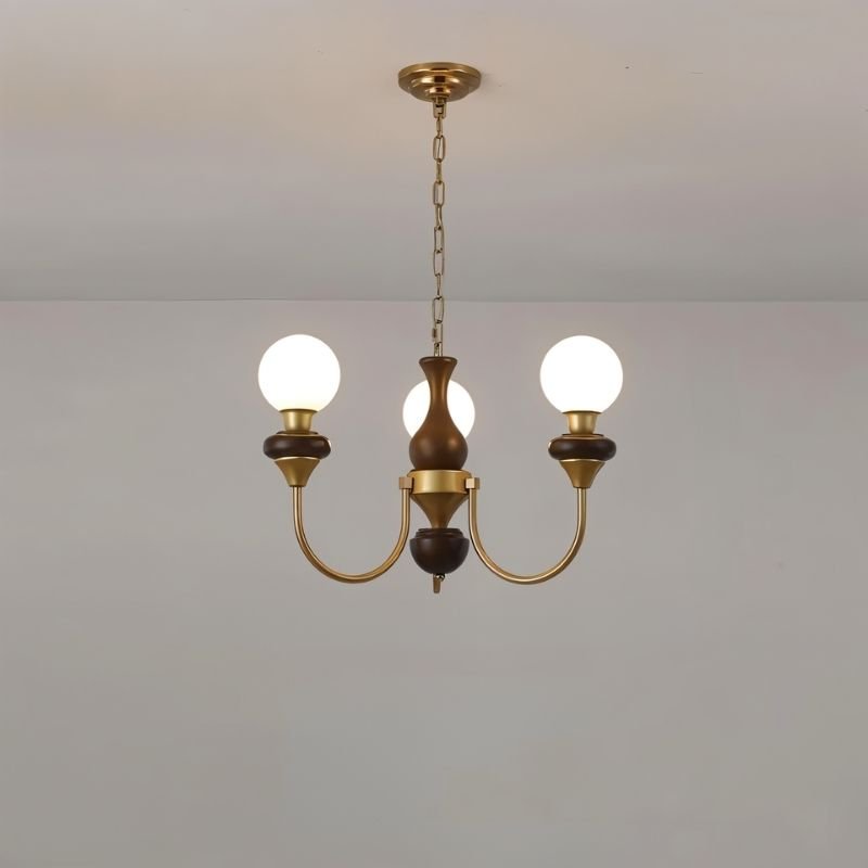 Modern Scyre chandelier with sleek metal frame and multiple glass shades, designed for contemporary interior lighting by Residence Supply.
