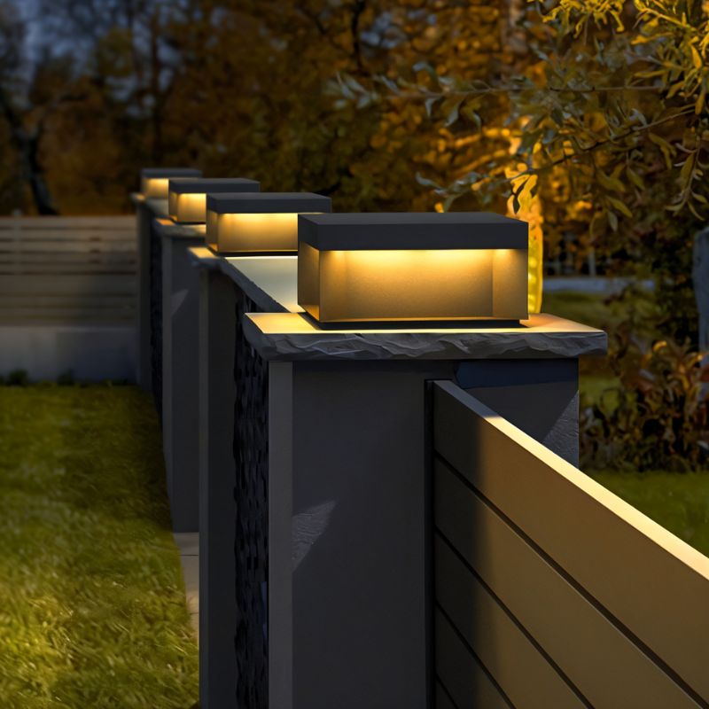 Senadina outdoor garden lamp by Residence Supply with a sleek black metal design and warm illumination for outdoor spaces.
