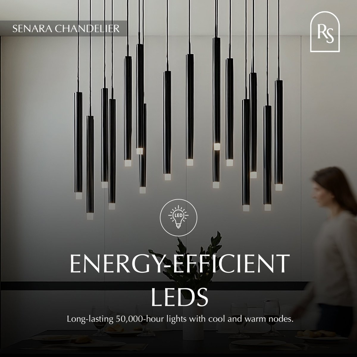 Elegant Senara Chandelier with multiple glass tiers and metal frame, hanging from a ceiling in a stylish interior setting.