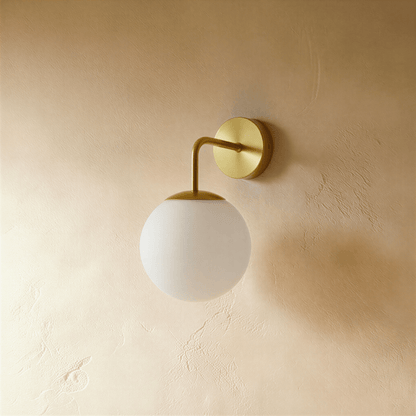 Modern Sfera Wall Lamp by Residence Supply with spherical glass shade and sleek metal wall mount, ideal for contemporary decor.