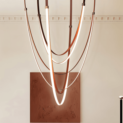 Shalom Leather Chandelier by Residence Supply featuring a modern design with leather accents and hanging light bulbs.