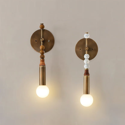 Shalti Wall Lamp by Residence Supply, modern wall-mounted lighting fixture with sleek design and matte finish on a white wall.