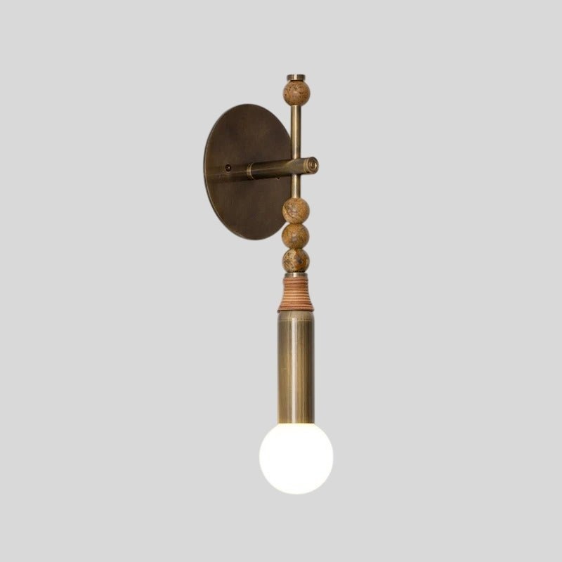 Residence Supply Shalti Wall Lamp with sleek metal finish and modern design, mounted on a wall for ambient lighting.