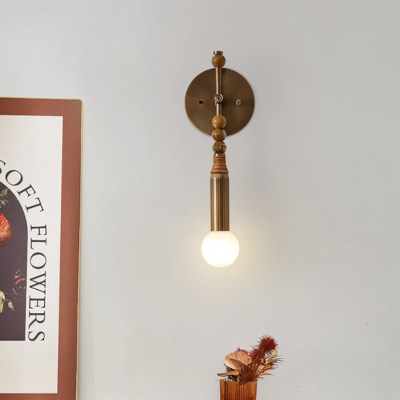 Residence Supply Shalti Wall Lamp featuring a sleek, modern design with a warm illuminated glow on a neutral wall.