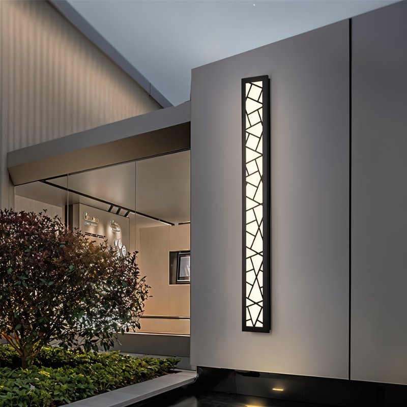 Shamil wall lamp by Residence Supply with a modern design, featuring a sleek metal finish and ambient lighting for indoor decor.