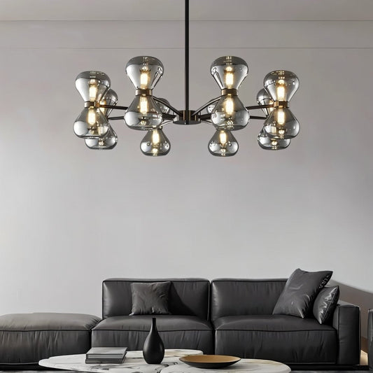 Smoked glass Silvine chandelier hanging in a modern living room, featuring multiple light bulbs and sleek design by Residence Supply.