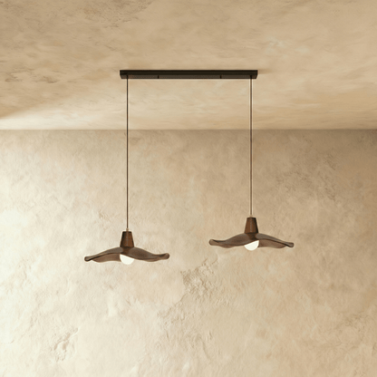 Residence Supply Siraj Pendant Light with sleek metal shade and adjustable cord hanging from ceiling in modern decor style.