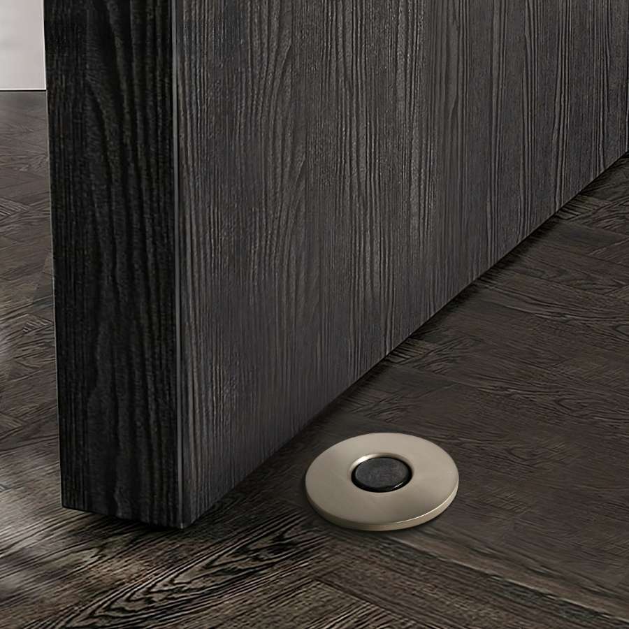 Residence Supply Siste Concealed Magnetic Door Stop installed on a door, demonstrating sleek, modern door hardware for home and garden.