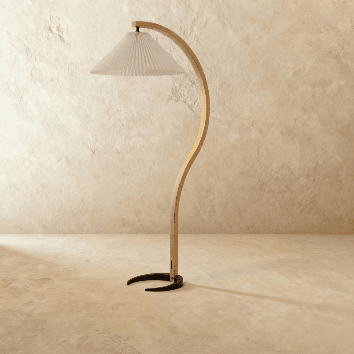 Skiastro Floor Lamp by Residence Supply featuring a modern, sleek design with a tall, curved metal stand and fabric shade.
