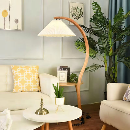 Skiastro Floor Lamp by Residence Supply with a sleek modern design and a tall, adjustable stand in a contemporary living room setting.