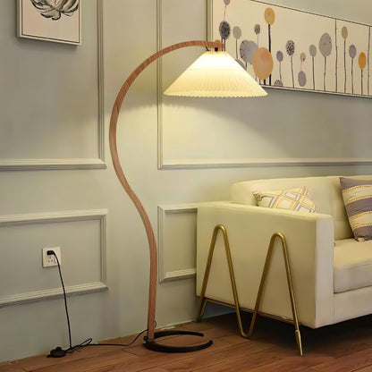 Skiastro Floor Lamp by Residence Supply with a sleek modern design and a tall, slender metal stand and a stylish lampshade.