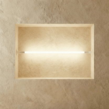 Modern Skyline Wall Lamp by Residence Supply mounted on a wall, featuring sleek metal design and ambient lighting.