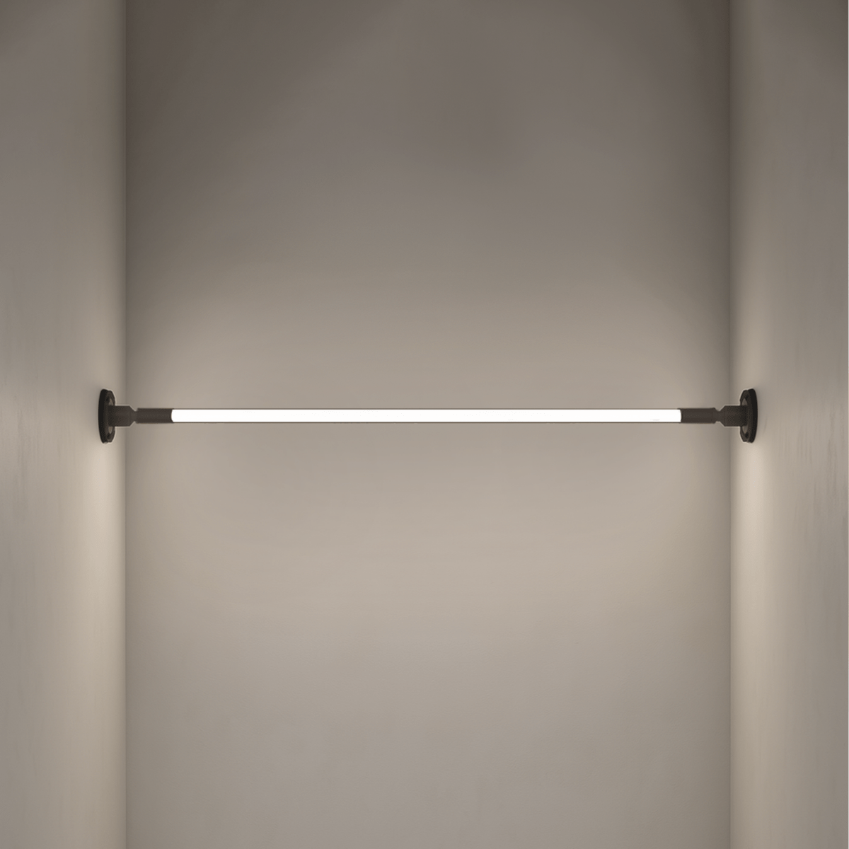 Residence Supply Skyline Wall Lamp mounted on a wall with a sleek, modern design and a warm lighting glow.