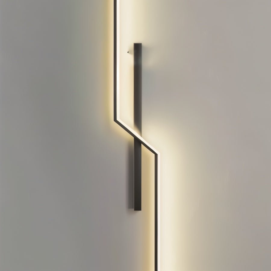 Modern slant wall lamp by Residence Supply featuring a sleek design and adjustable arm for versatile lighting.