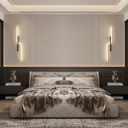 Residence Supply slant wall lamp mounted on a wall with a modern design, featuring a sleek metal arm and adjustable shade.