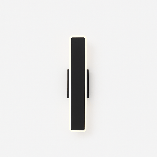 Residence Supply slant wall lamp with adjustable arm and modern design mounted on a neutral-colored wall.