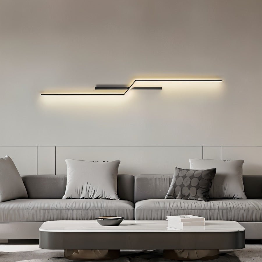 Modern slant wall lamp by Residence Supply with adjustable arm and sleek design, ideal for reading or accent lighting.