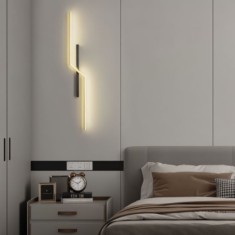 Residence Supply slant wall lamp with adjustable arm and modern design mounted on a wall for ambient lighting.