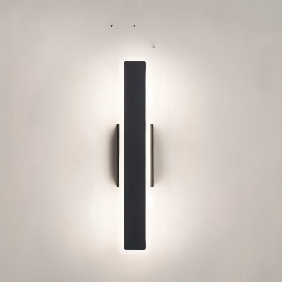 Modern slant wall lamp by Residence Supply with sleek metal arm and adjustable shade, mounted on a wall for stylish lighting.