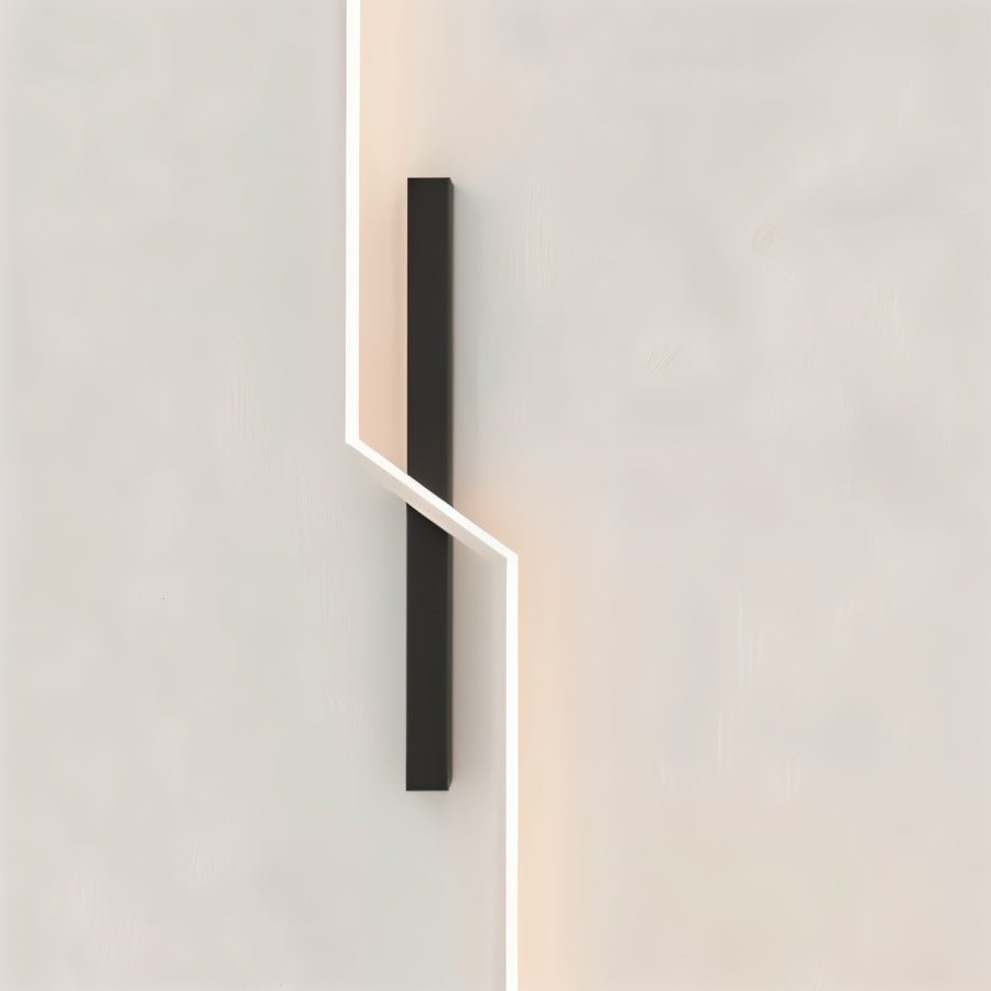 Residence Supply slant wall lamp with adjustable arm and modern design, mounted on a white wall for ambient lighting.