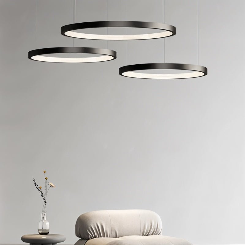 Solas Round Chandelier by Residence Supply featuring a modern circular metal frame with multiple light bulbs.