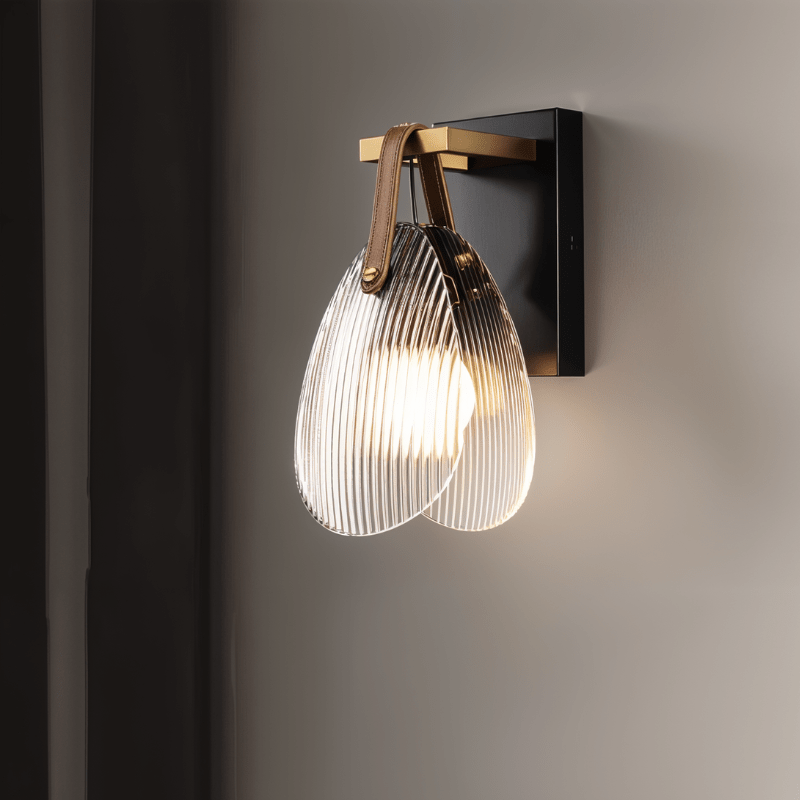 Solya Wall Lamp by Residence Supply, modern black wall light with sleek design and adjustable arm, mounted on a white wall.