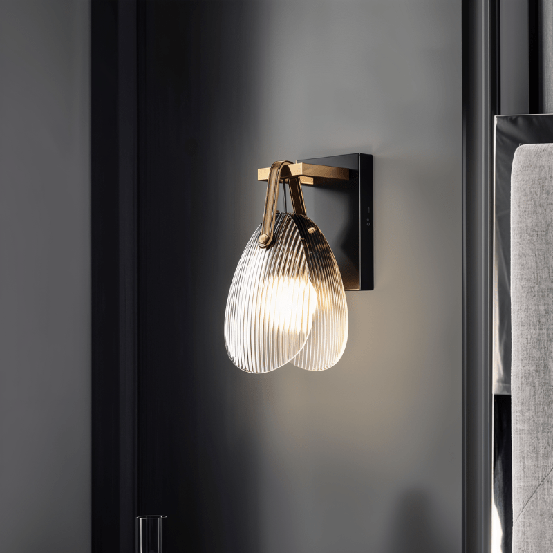 Residence Supply Solya Wall Lamp mounted on a wall with a sleek, modern design and adjustable arm for versatile lighting.
