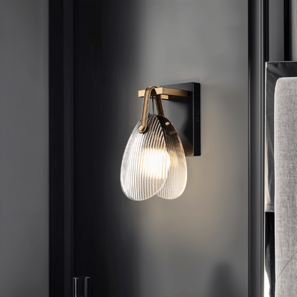 Residence Supply Solya Wall Lamp mounted on a wall with a sleek, modern design and adjustable arm for versatile lighting.