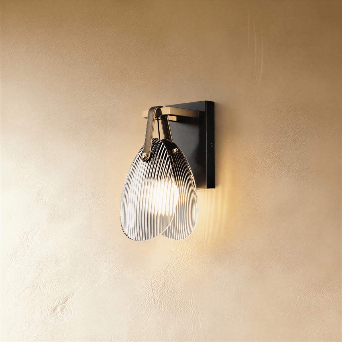 Residence Supply Solya Wall Lamp mounted on a wall with a sleek, modern design and warm lighting.