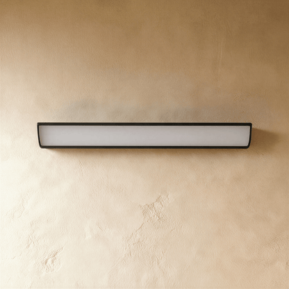 Outdoor wall lamp by Residence Supply featuring a modern design with a sleek metal finish and clear glass shade.