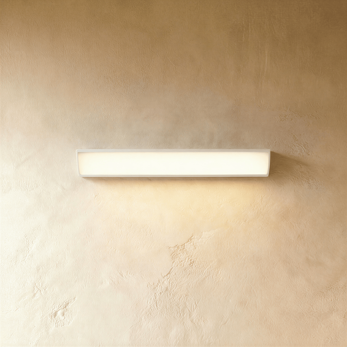 Residence Supply Sopdet outdoor wall lamp with modern design and metal finish, mounted on a wall for outdoor lighting.