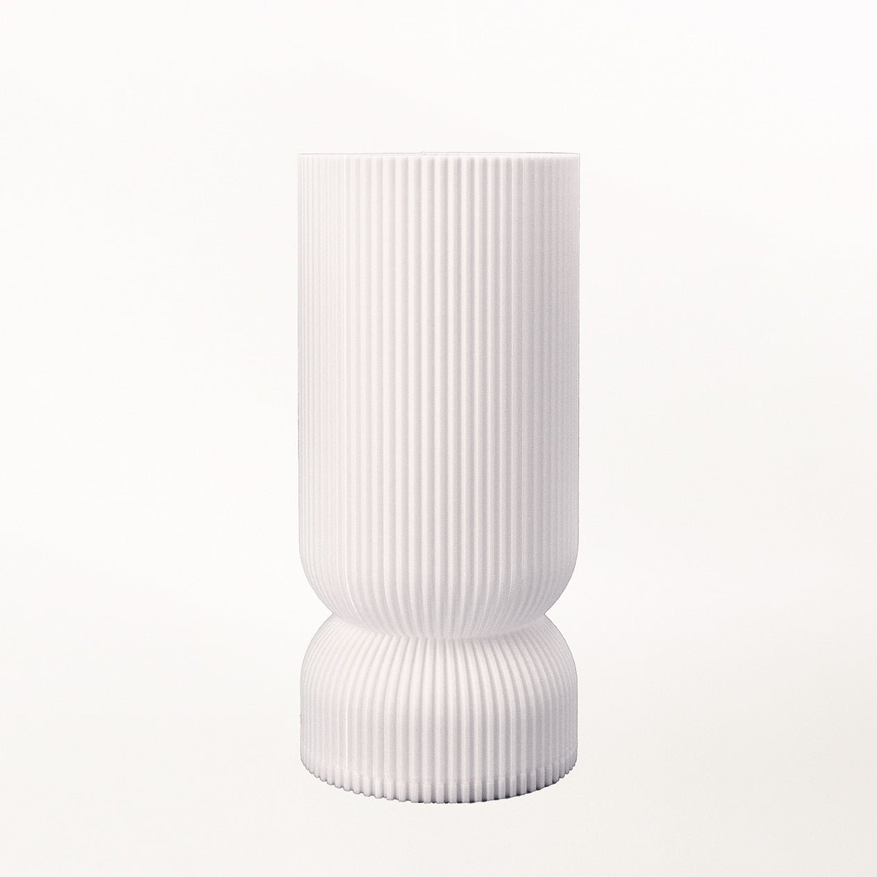 Terra Labs Stance Table Lamp with a sleek, modern design featuring a cylindrical base and a fabric lampshade.