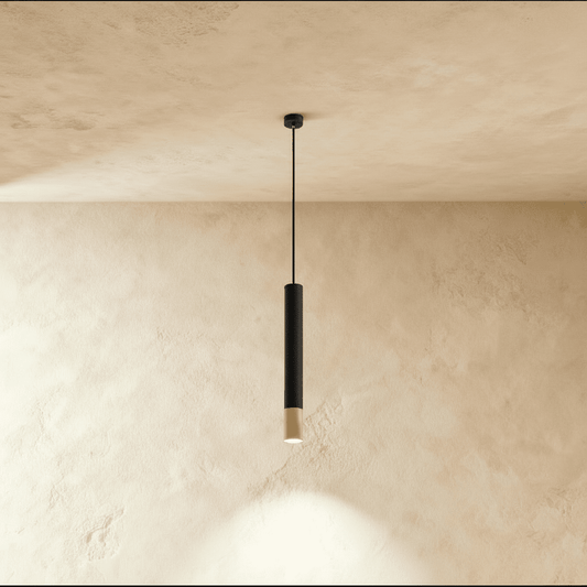Modern Stark Pendant Light from Residence Supply with a sleek metal finish and minimalist design, hanging from a ceiling fixture.