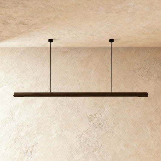Modern Svelte Pendant Light by Residence Supply featuring a sleek design and a warm ambient glow.