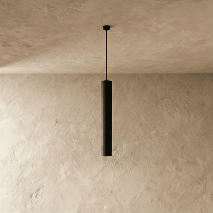 Talo Pendant Light by Residence Supply hanging from ceiling with a modern design and warm lighting effect.