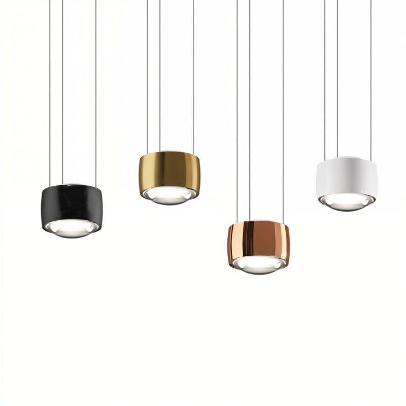 Tejas Pendant Light from Residence Supply featuring a modern metal fixture with a warm-toned glass shade hanging from a ceiling mount.