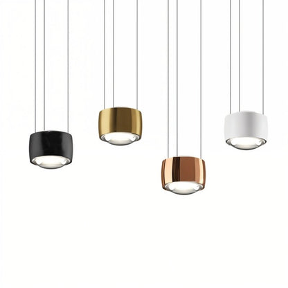 Tejas Pendant Light from Residence Supply featuring a modern metal fixture with a warm-toned glass shade hanging from a ceiling mount.