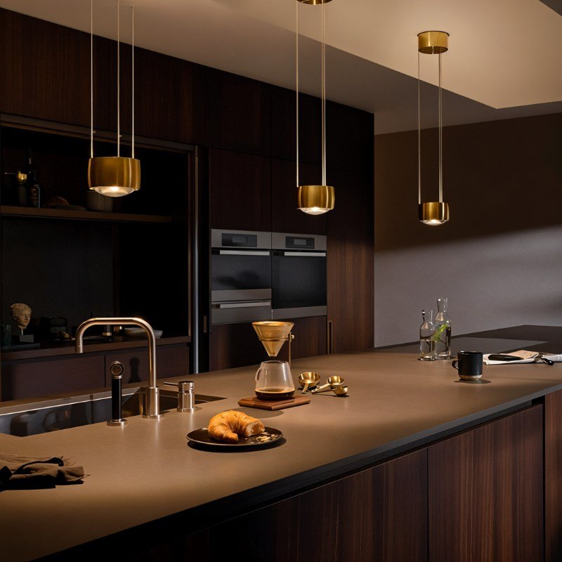 Tejas Pendant Light by Residence Supply hanging from ceiling with a sleek, modern design and warm illumination.
