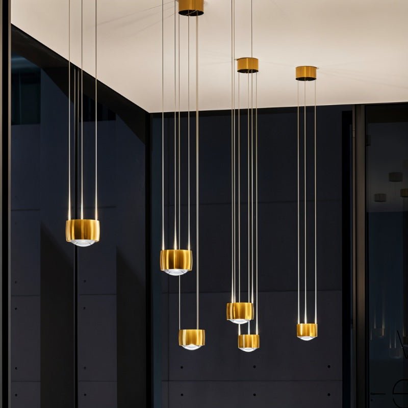 Tejas Pendant Light by Residence Supply hanging from ceiling with a modern design and warm light illumination.