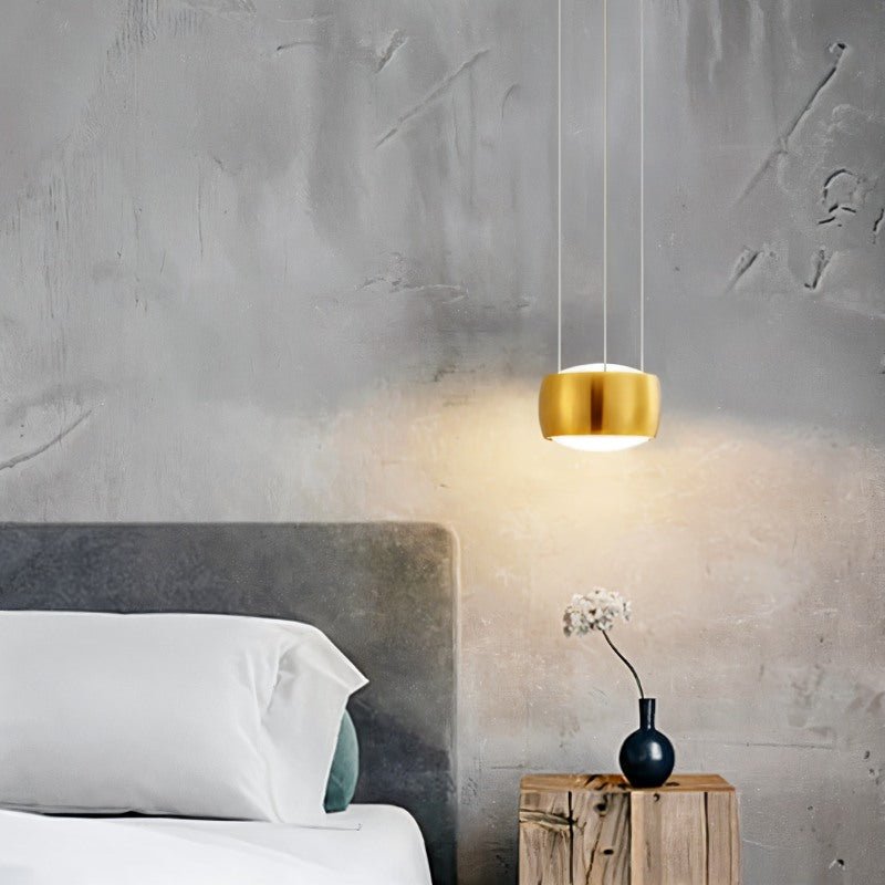 Tejas Pendant Light by Residence Supply hanging from ceiling with a modern design and warm lighting.