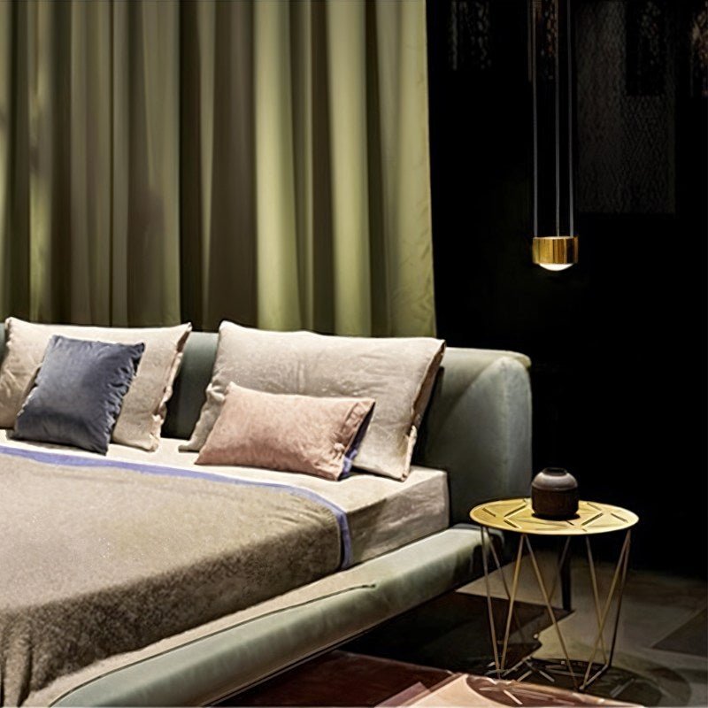 Tejas Pendant Light by Residence Supply hanging from ceiling with warm glow, modern design, and metal finish.
