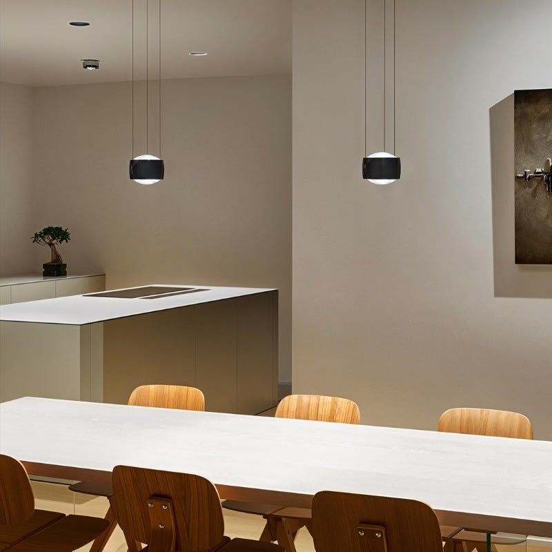 Tejas Pendant Light by Residence Supply hanging from ceiling with metal and glass design in modern home decor setting