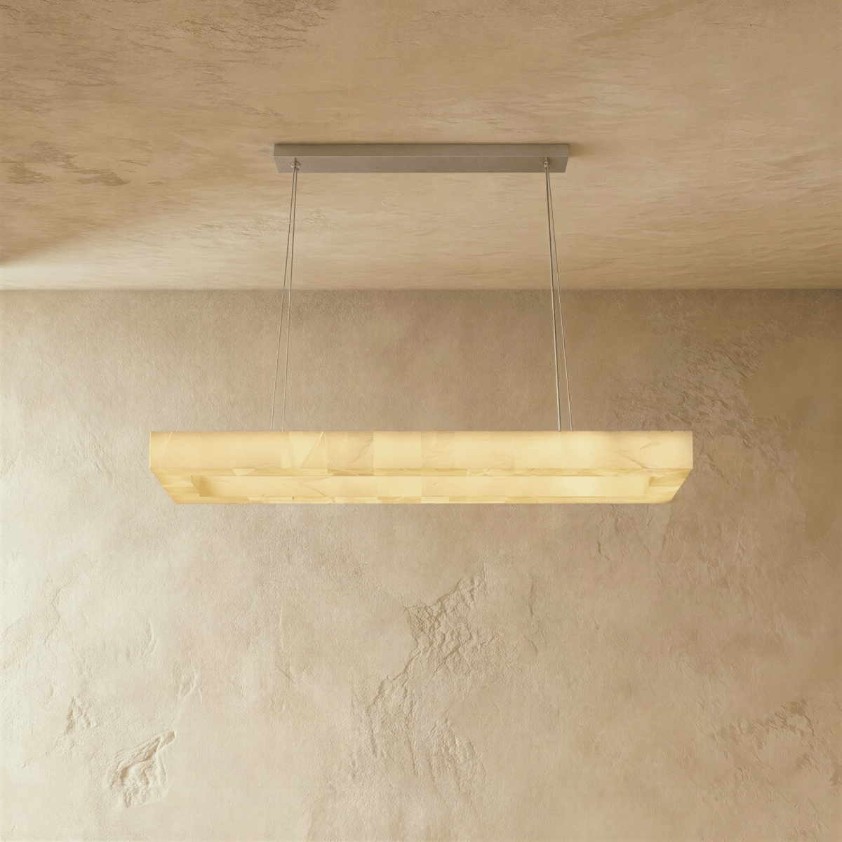 Teva rectangular alabaster chandelier with a modern design and warm lighting, mounted on a ceiling with visible fixture details.