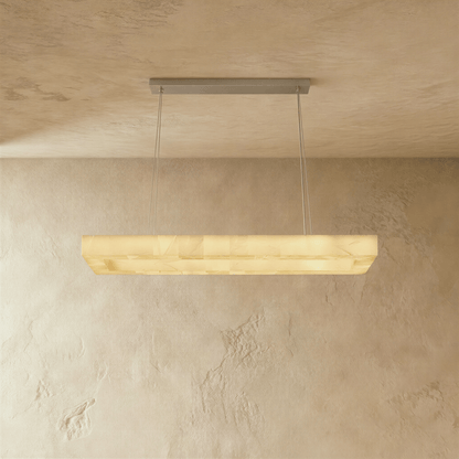 Teva rectangular alabaster chandelier with a modern design and warm lighting, mounted on a ceiling with visible fixture details.
