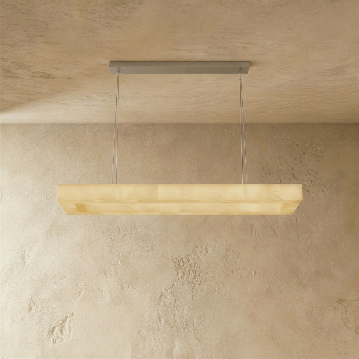 Teva rectangular alabaster chandelier with warm lighting and modern design, featuring a sleek metal frame and soft alabaster shades.