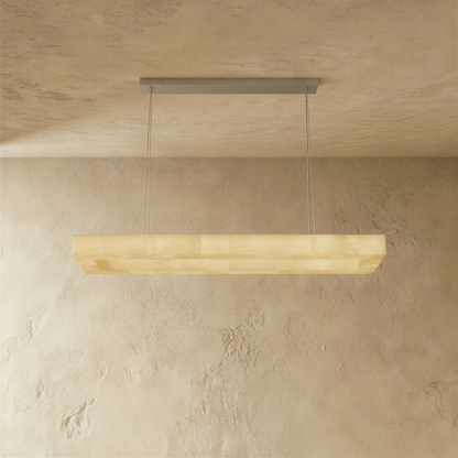 Teva rectangular alabaster chandelier with warm lighting and modern design, featuring a sleek metal frame and soft alabaster shades.